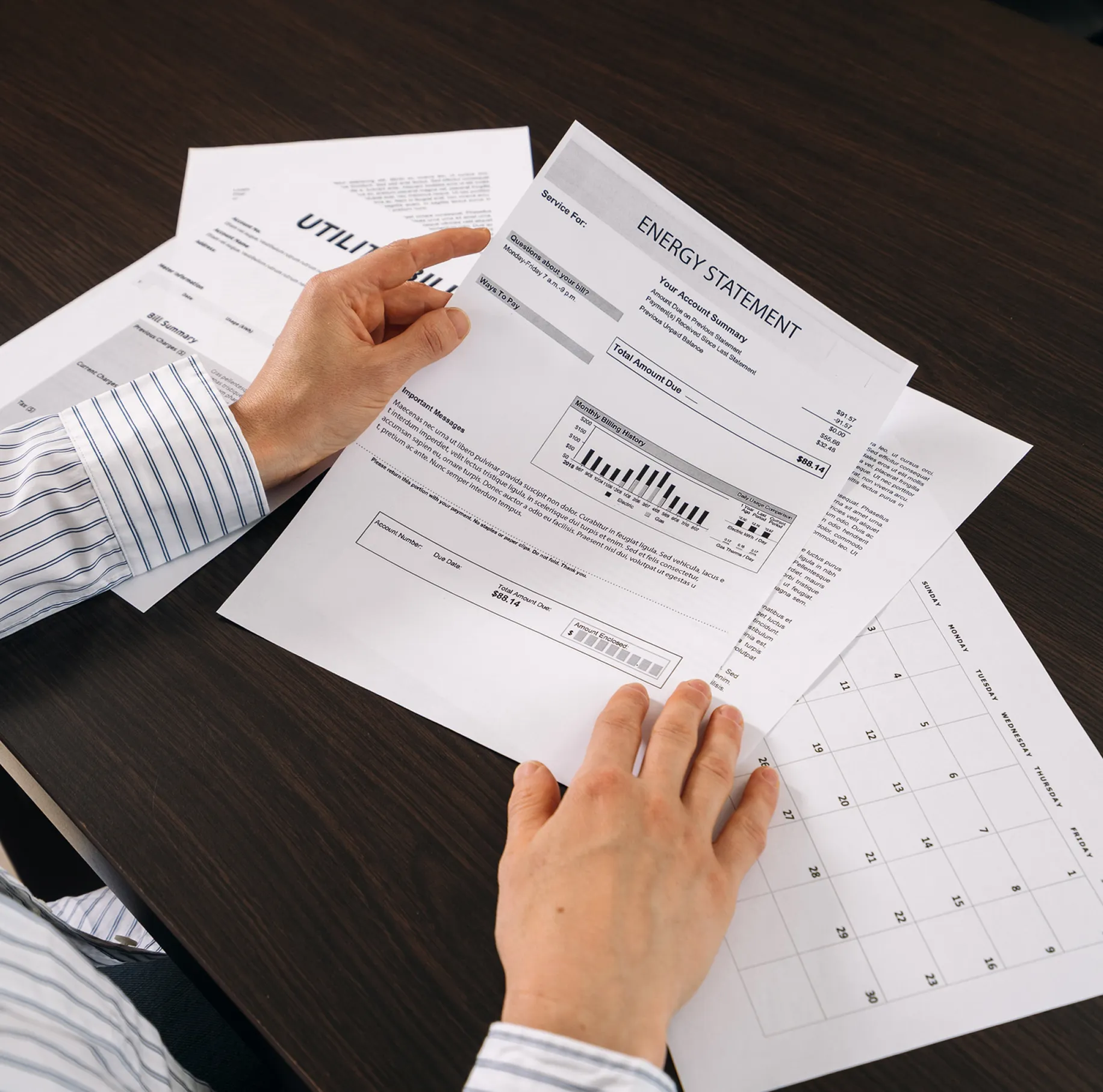 Person reviewing an energy bill statement.