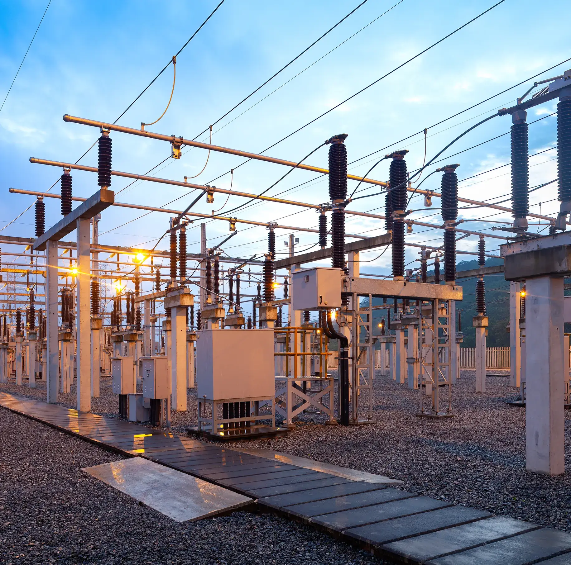 Electrical substation with high-voltage equipment.