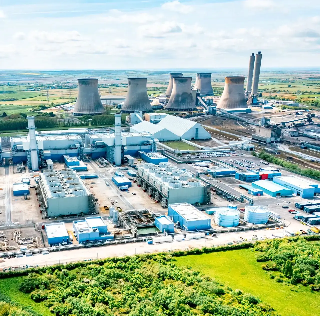 Industrial power plant with cooling towers landscape.